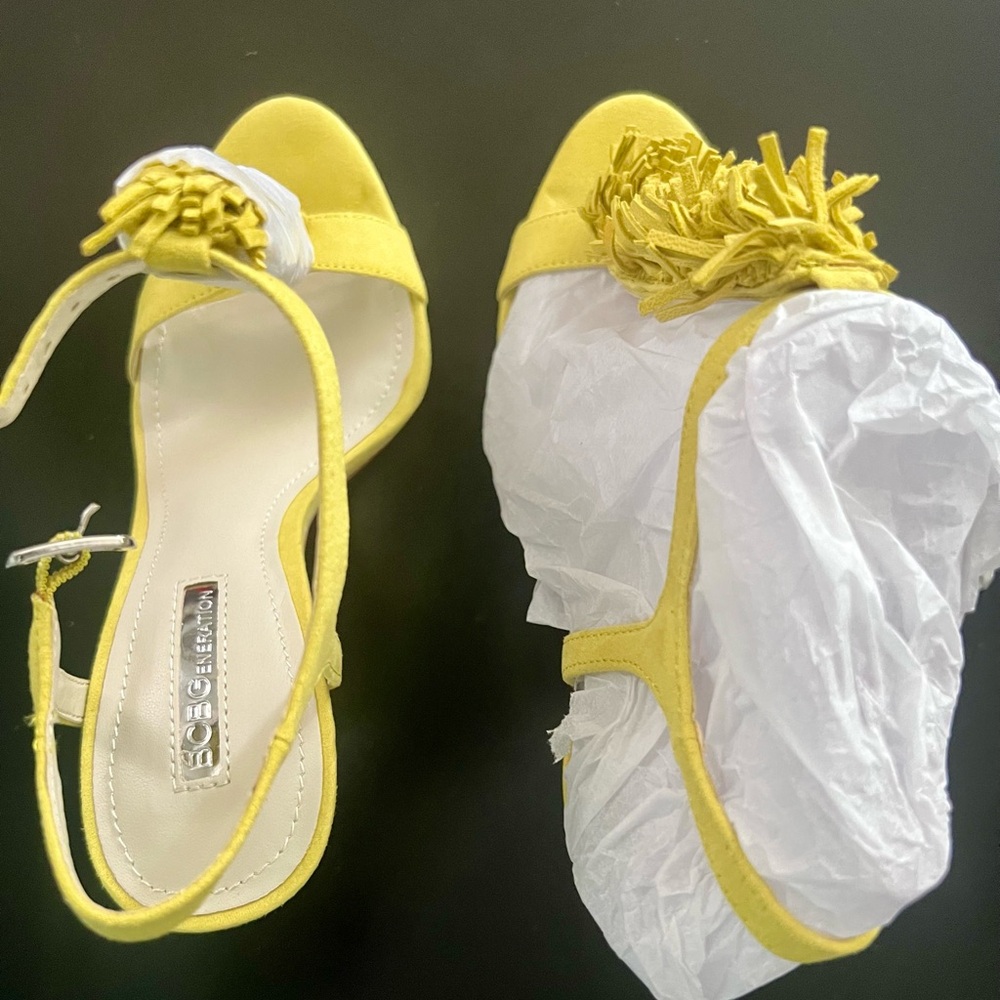Beautiful vibrant yellow suede 4 inch heel sandals with detail on front strap.